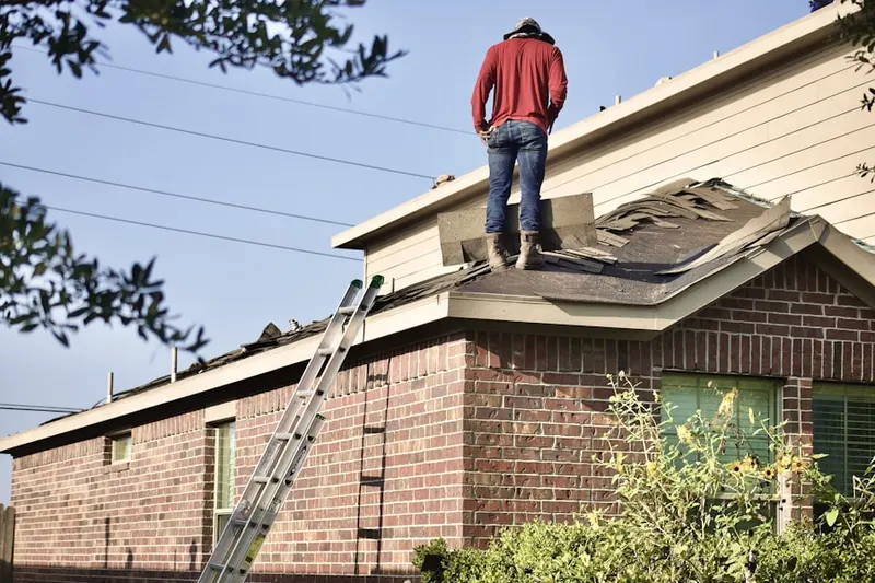Professional roofer working on a residential roof in Bear River City